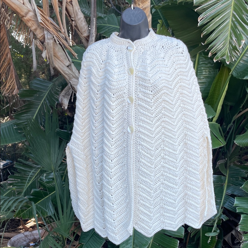 hand knit  cape with large mother of pearl buttons